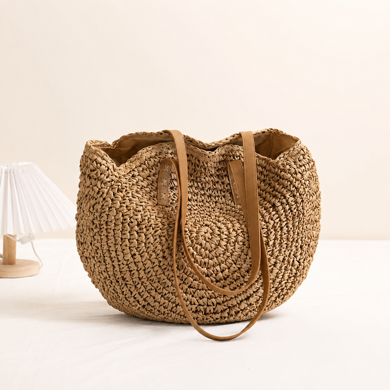Linda | Ronde tas van gevlochten stro - hazelnootkleur