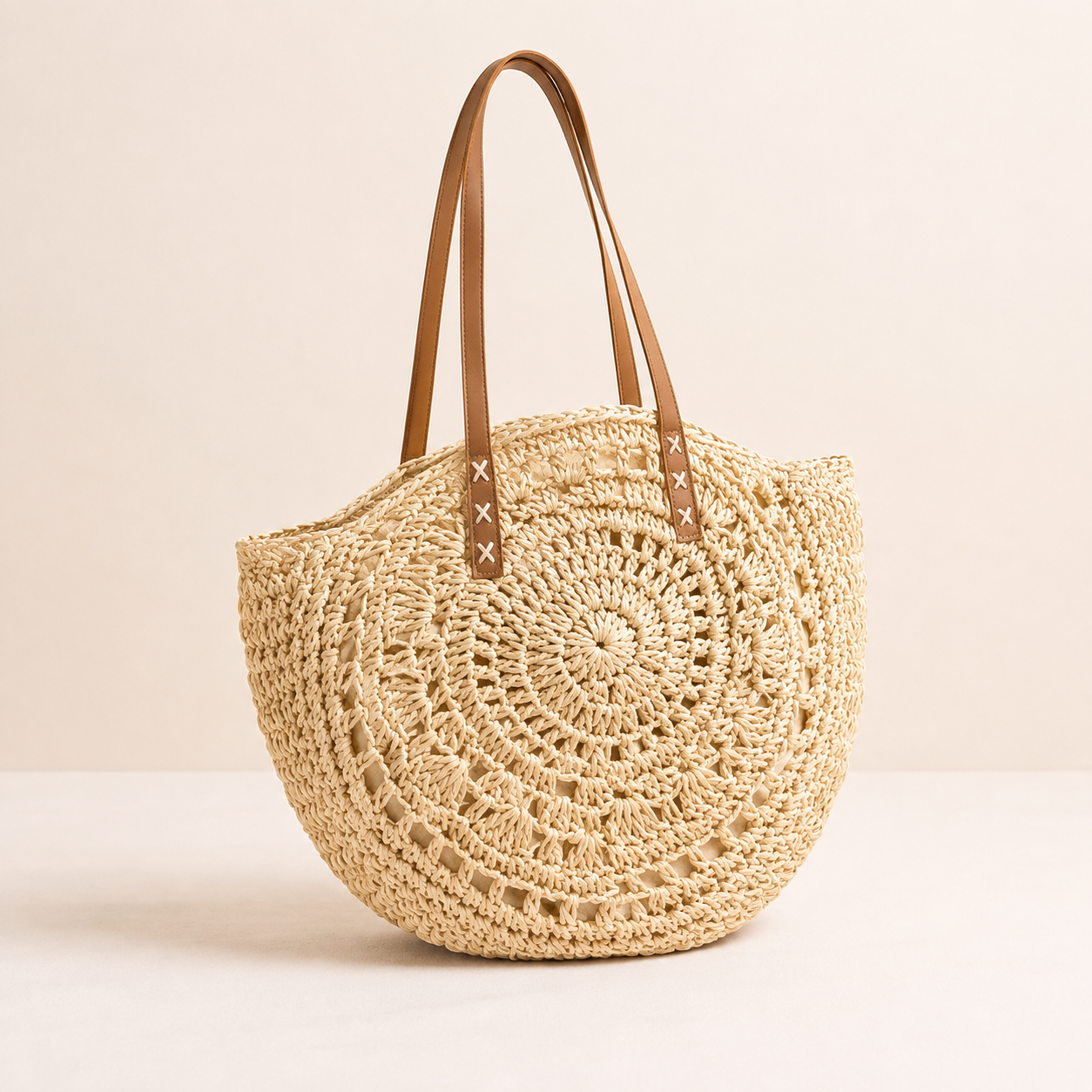 Luigia | Ronde tas van gevlochten stro met motief — Beige naturel
