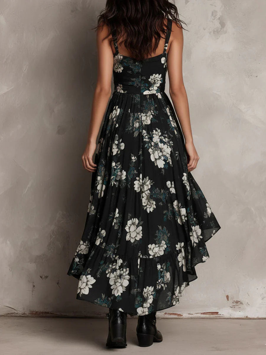 Lange zwarte straploze jurk in boho-stijl met bloemenprint en asymmetrische snit